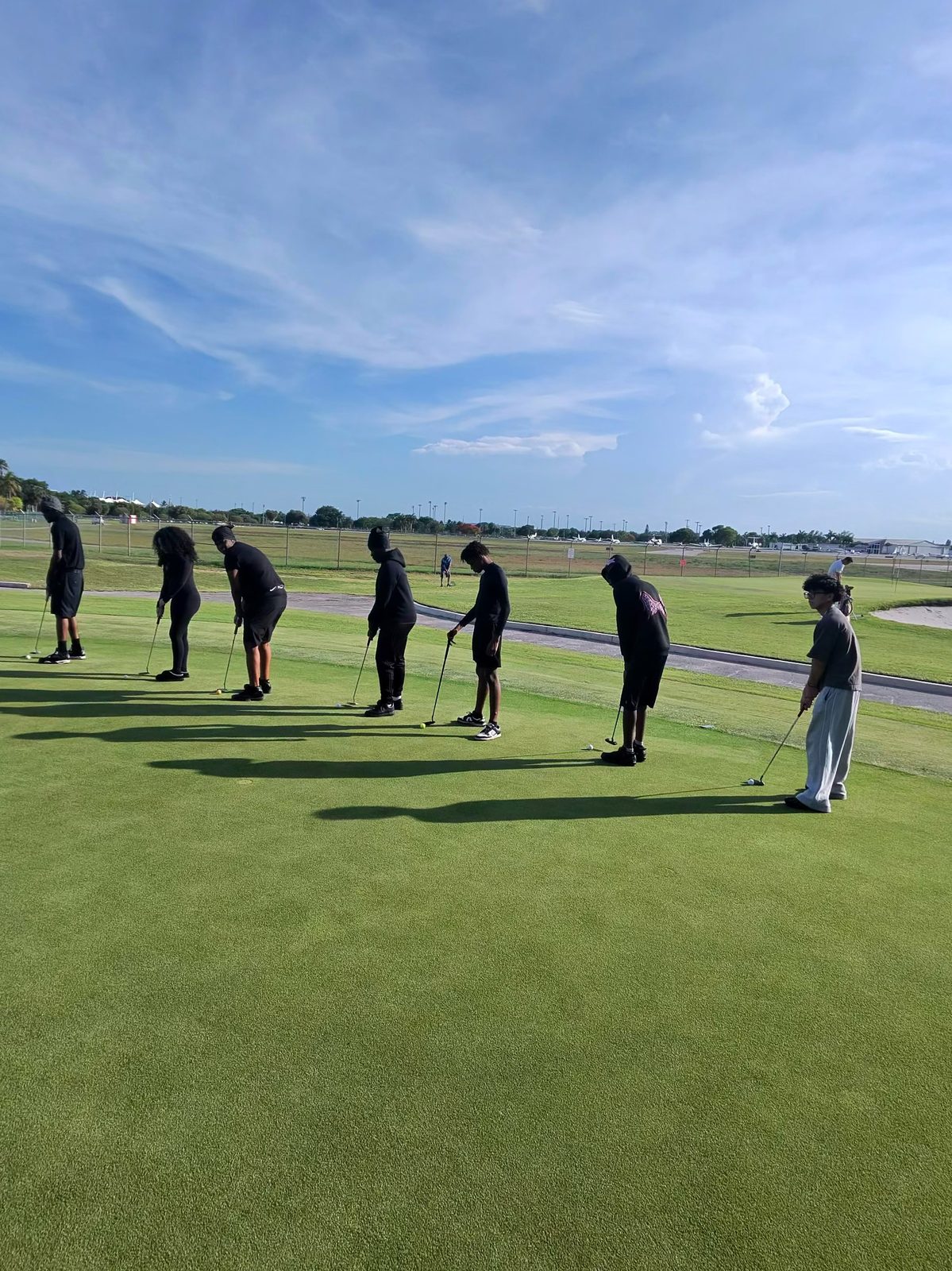 FFGF youth on the putting green during a golf lesson