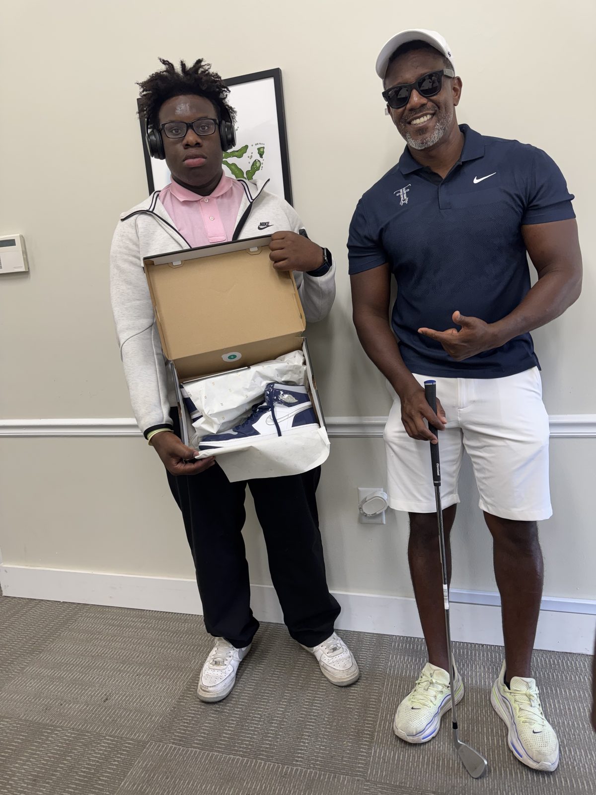 FFGF coach presenting a youth participant with a gift during a program recognition moment